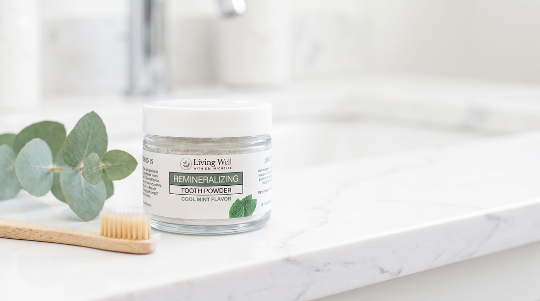 Remineralizing Tooth Powder, a fluoride-free hydroxyapatite tooth powder by Living Well with Dr. Michelle, on a bright bathroom counter