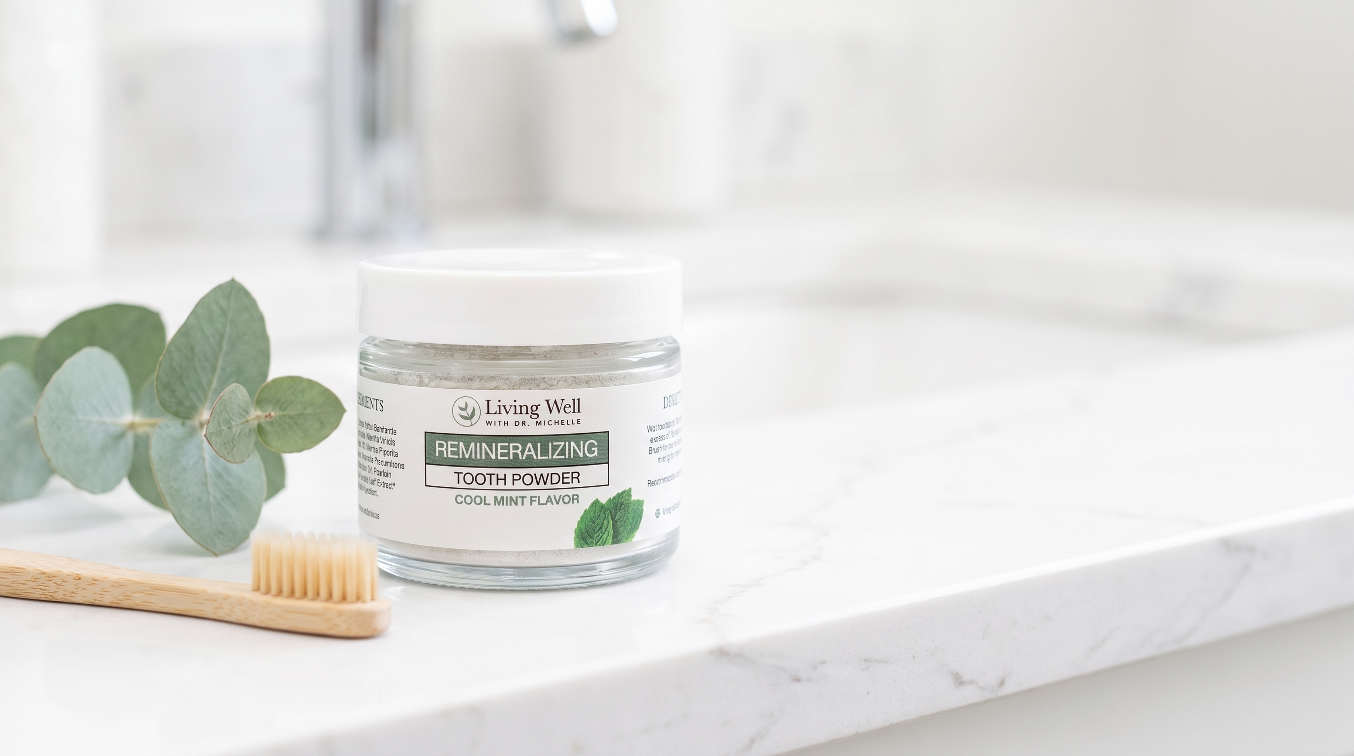 Remineralizing Tooth Powder, a fluoride-free hydroxyapatite tooth powder by Living Well with Dr. Michelle, on a bright bathroom counter