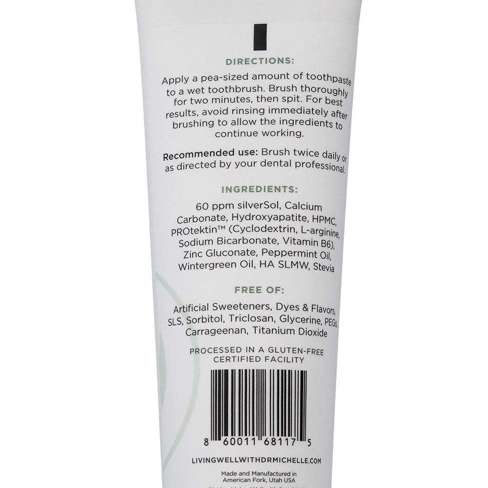 Back of remineralizing toothpaste tube showing directions for use, full ingredient list including hydroxyapatite and PROtektin™, and fluoride-free, non-toxic formulation details.