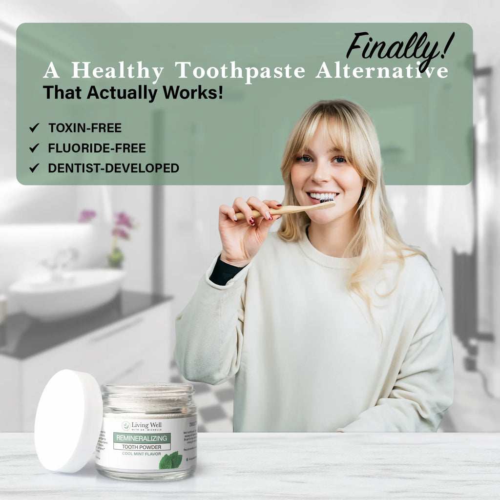 Woman brushing with remineralizing tooth powder in bathroom with Living Well hydroxyapatite formula