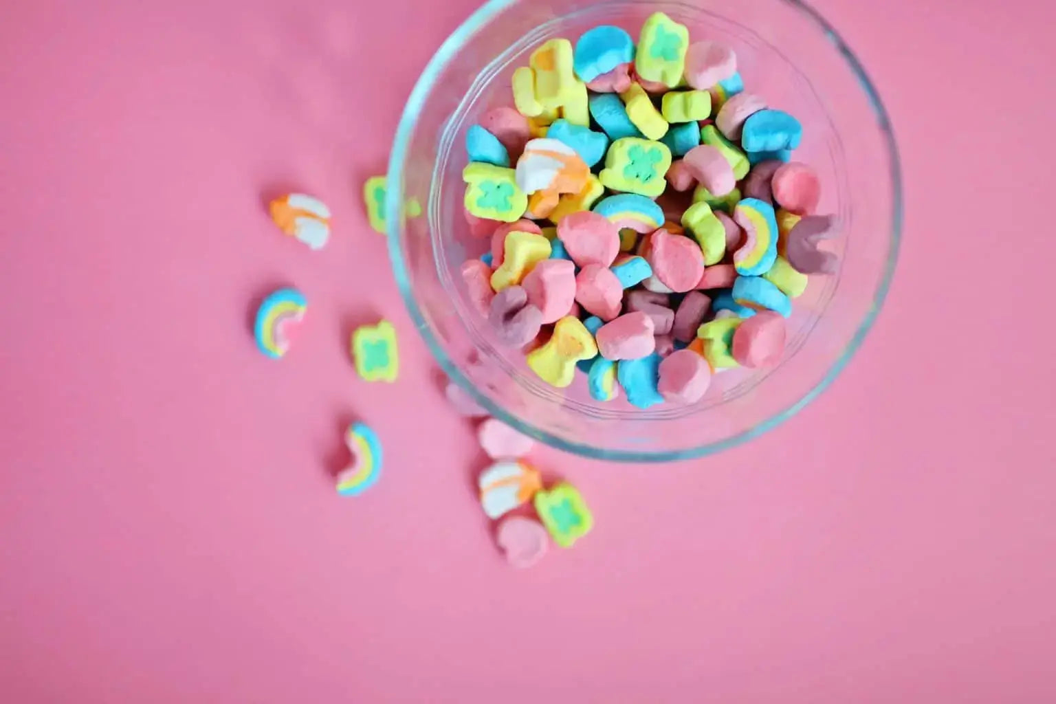 Brightly colored marshmallow cereal pieces viewed from above