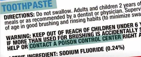 Poison control warning label printed on a tube of fluoride toothpaste
