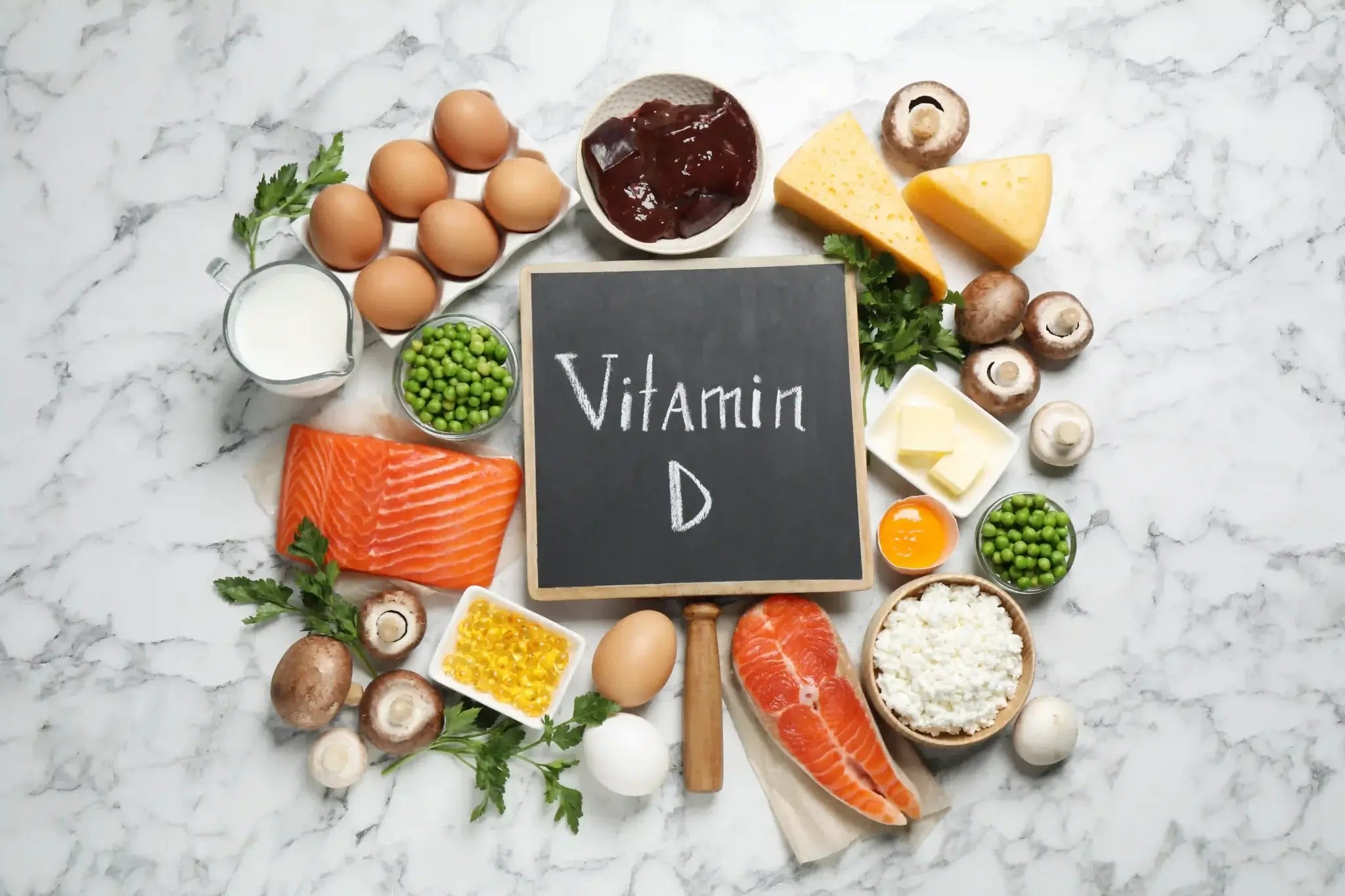 Vitamin D rich foods including salmon, eggs, and dairy